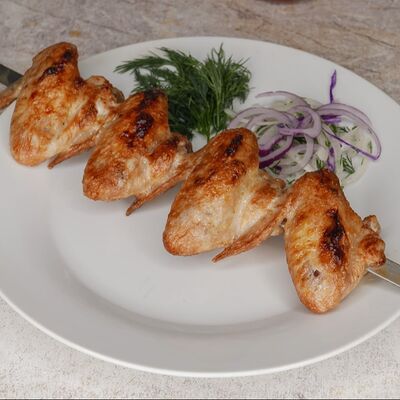 Куриные крылышкив Узбекская кухня по цене 280 ₽
