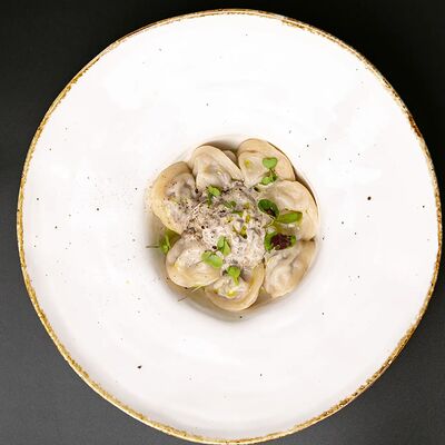 Пельмени с грибным соусом в Luna lounge по цене 599 ₽
