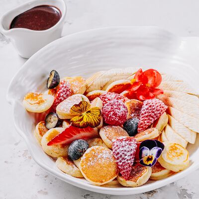 Мини-панкейки в шоколадном соусе в Casa di panna по цене 480 ₽