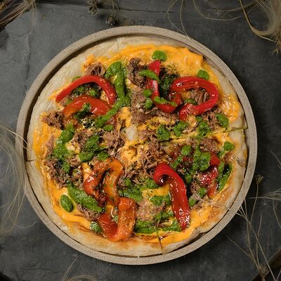 Лепешка роти с томленой говядиной в Zanzibar по цене 760 ₽