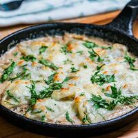 Запечённые вареники с картофелем и грибным соусом в Eva bistro