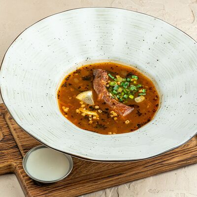 Мясная солянка с колбасками и копченым ребрышком в Brasserie Kriek по цене 760 ₽