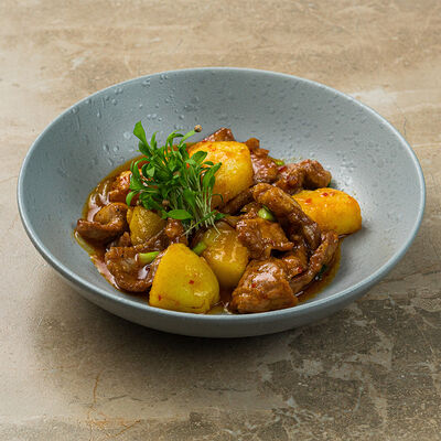 Свинина с картофелем по-азиатски в Бали по цене 576 ₽