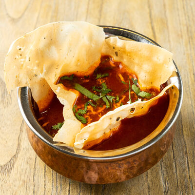 Томатный суп с хрустящим пападом в Bollywood Nights по цене 249 ₽