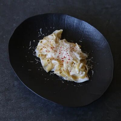 Паста со сливочным соусом и пармезаном в KOKK по цене 590 ₽