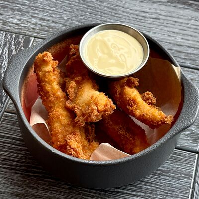 Куриные стрипсы с сырным соусом в Nebelka bar по цене 490 ₽