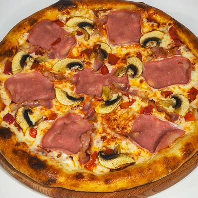 Пицца Американка в Добрая кухня по цене 699 ₽