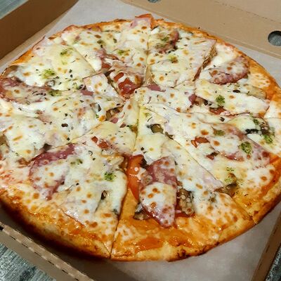Деревенская в Вкусно Пицца по цене 640 ₽