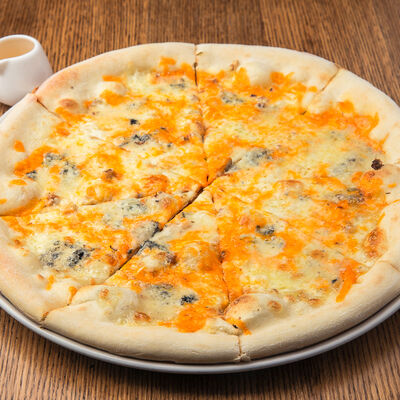 Пицца Четыре сыра в Помидорро по цене 625 ₽