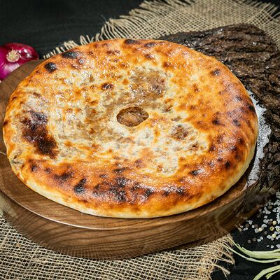 Осетинский пирог с капустой 28 см в Пицца Пала по цене 540 ₽