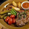 Жареная свиная шейка с картофелем и разносолами в Зефир по цене 800