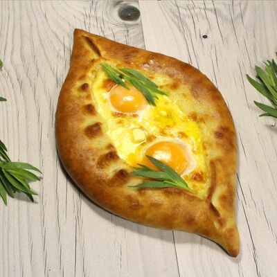 Хачапури по-аджарски с перепелиными яйцами в Vagr по цене 370 ₽