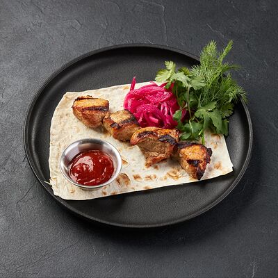 Шашлык из свинины в По Чесноку по цене 634 ₽