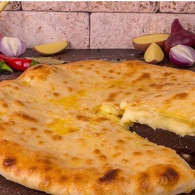 Пирог с картофелем и сыромв National по цене 1000 ₽