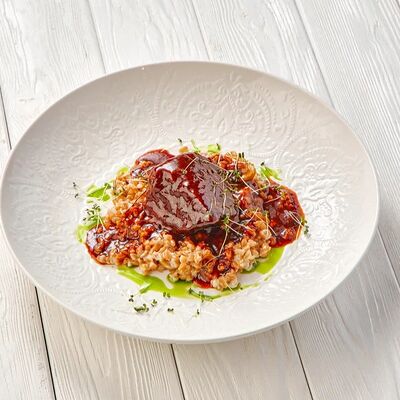 Томленая баранина в Пармезан по цене 865 ₽