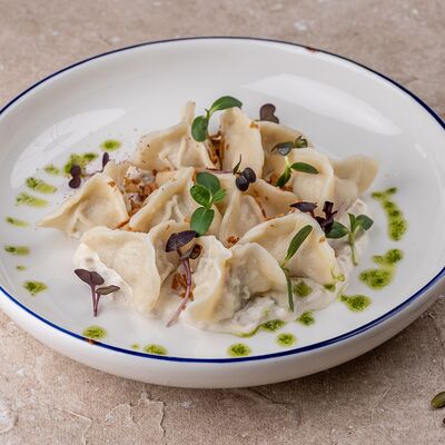 Пельмени с курицей под грибным соусом в Русская усадьба по цене 485 ₽