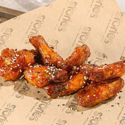 Крылья, жаренные в соусе барбекю в Stories по цене 430 ₽