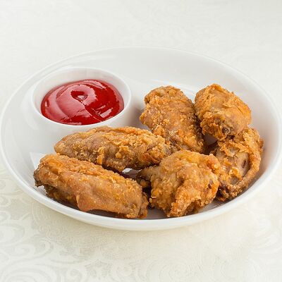 Острые куриные крылышки в хрустящих хлопьях в Римские каникулы по цене 270 ₽