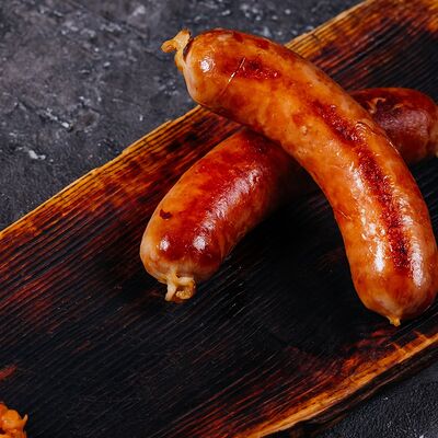 Свиные колбаски с тушеной капустой в Пламя по цене 1290 ₽