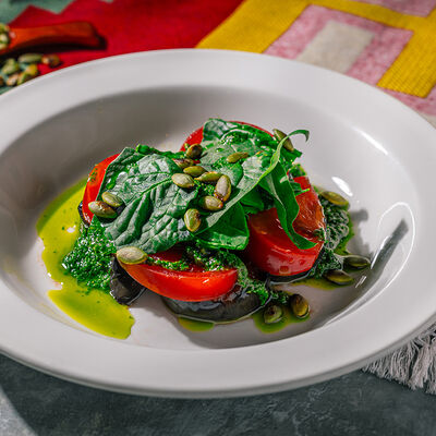 Баклажаны с томатами и грузинским песто с цицмати в Хачапури по цене 490 ₽