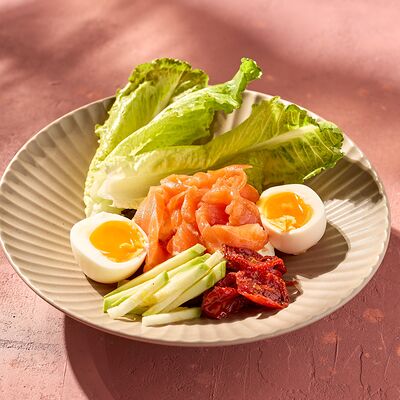 Оладьи из кабачка с мягким яйцом и форелью в KITCHEN по цене 690 ₽