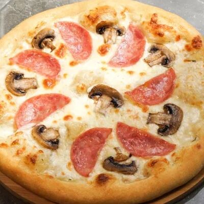 Пицца с ветчиной и грибами в Мама испекла по цене 690 ₽