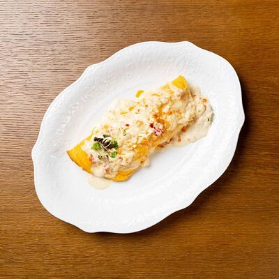 Омлет с крабом, пармезаном и соусом берблан в Tutta La Vita по цене 1300 ₽