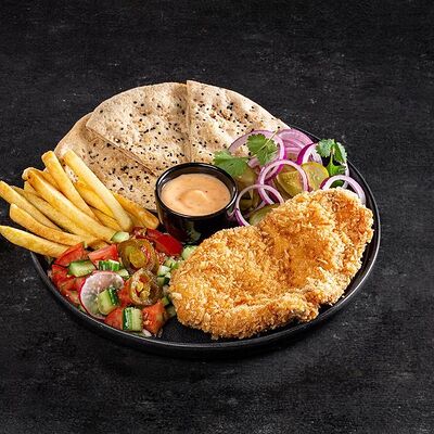 Шницель на тарелке в Bright Israeli Grill по цене 510 ₽