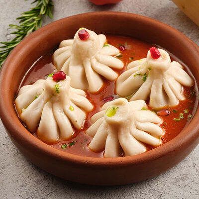 Хинкали в соусе чакапули в Грузина Мама по цене 565 ₽