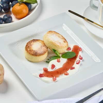 Сырники домашниев Prosto кофе & кухня по цене 470 ₽