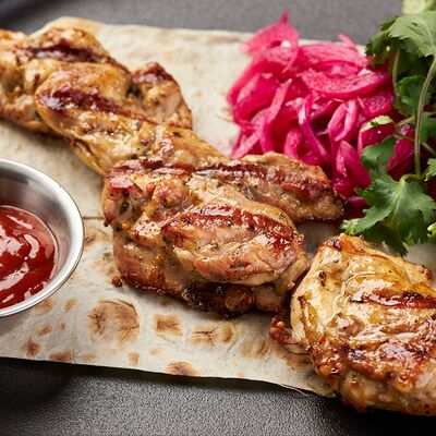 Шашлык из курицы в По Чесноку по цене 555 ₽