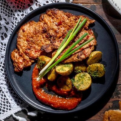 Свинина по-мегрельски в Хачапури тетушки Марико по цене 685 ₽