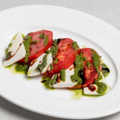 Сулугуни с томатами в соусе чимичури в Джованни по цене 395 ₽