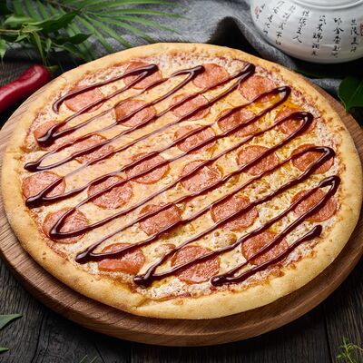 Пицца Пеперони BBQ в Кухня МОМО по цене 801 ₽