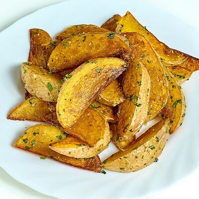 Картофель по-деревенски в Кафе Наше Место по цене 220 ₽