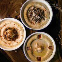 Логотип Taam Hummus Bar