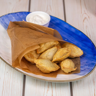 Жареные посикунчики с картошкой и грибами в Селёдочная по цене 402 ₽