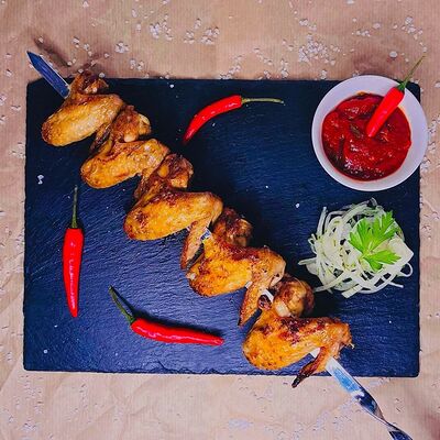 Куриные крылья spicy в Бардак на углях по цене 520 ₽