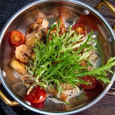 Тёплый салат с кальмаром и картофелем на углях в The Kabak по цене 910 ₽