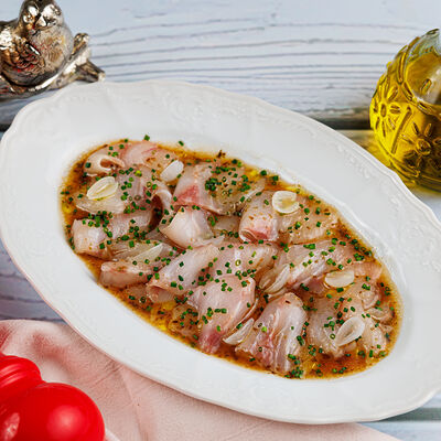 Крудо из сибаса в Lucia osteria по цене 1540 ₽