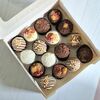Пирожные со сливочной начинкой в шоколаде ассорти с орехами и малиной M в Marys Cakes по цене 2590