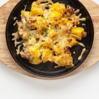 Картофель, запечённый со свининой в КинзаЗа по цене 390 ₽