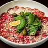 Карпаччо из говядины с маслом белого трюфеля и кунжутным соусом с каперсами в Гости Рестопаб по цене 45