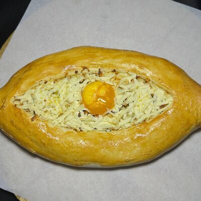 Хачапури по-аджарскив Мёд по цене 2795 ₸