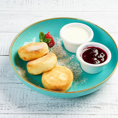 Сырники со сметаной в АндерСон по цене 460 ₽