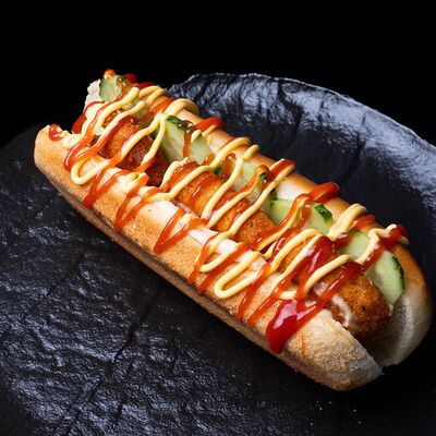 Хот-дог с куриными наггетсами в Amigoos по цене 330 ₽