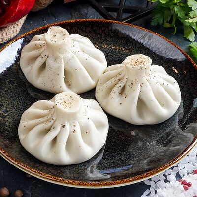 Хинкали с говядиной и свининой в Чинтамани по цене 490 ₽