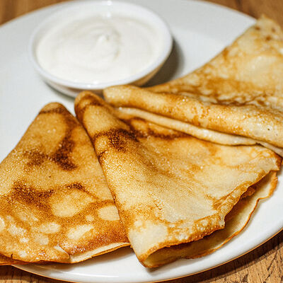 Блинчики со сметаной в Кафе Наше Место по цене 230 ₽