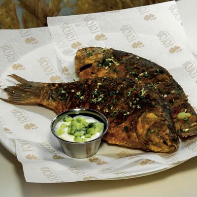 Жареные караси со сметанно-огуречным соусомв Гоголь по цене 650 ₽