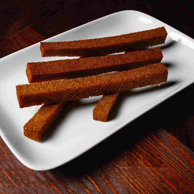 Гренки из черного хлеба с чесноком в Шиканландия по цене 150 ₽